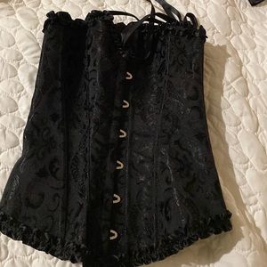 Black corset, small never worn too lose for me.